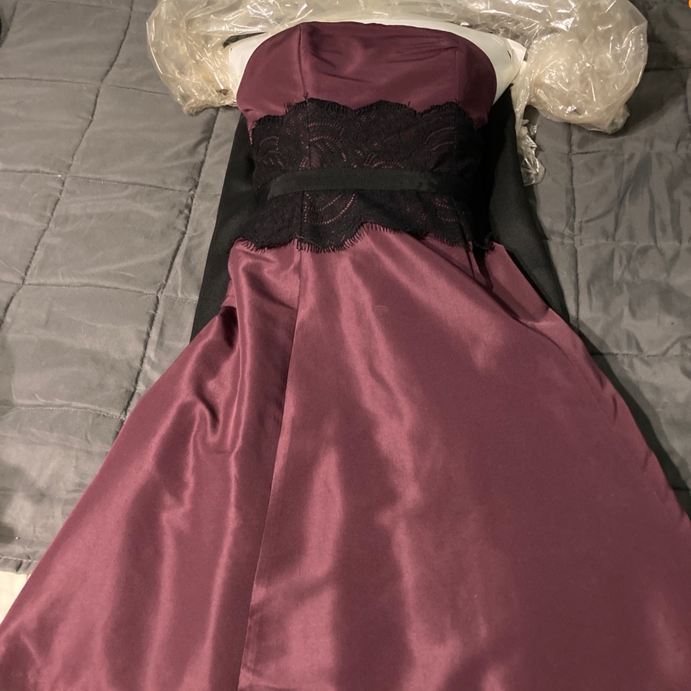 Strapless purple satin knee length dress with black lace.